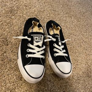 Brand new never worn black and white low top converse. Size 7.
